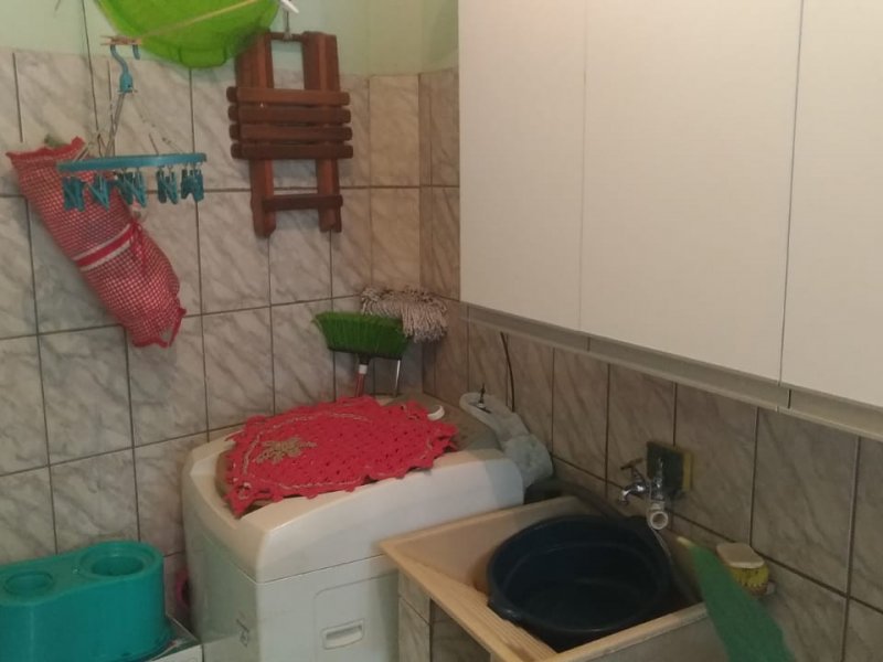 Casa à venda Conjunto Habitacional Águia de Haia com 306m² e 4 quartos por R$ 380.000 - 2067235987-24-lavanderia-casa-terrea.jpeg