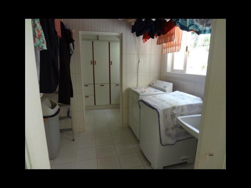 Casa de condomínio à venda Centro com 450m² e 4 quartos por R$ 1.500.000 - 130111574-16-lavanderia.JPG