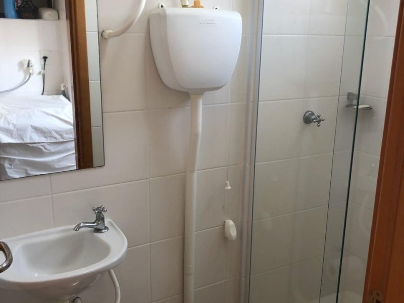 Apartamento à venda Armação com 72m² e 3 quartos por R$ 480.000 - 1065835227-banheiro-fundo.jpeg