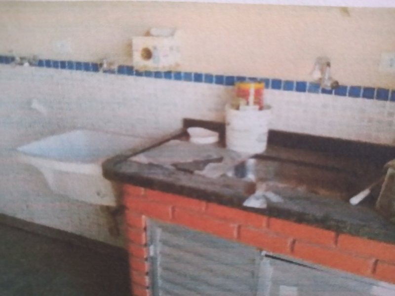 Casa à venda Vila Nilo com 102m² e 3 quartos por R$ 335.000 - 1464710255-10-varanda-pia-apoio-churrasqueira-e-tanque.jpg