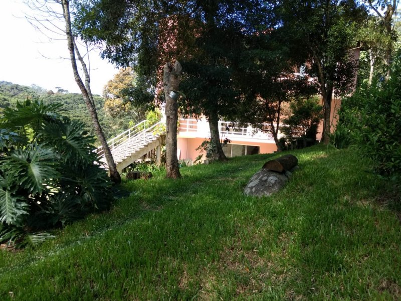 Casa de condomínio à venda Centro com 400m² e 3 quartos por R$ 1.680.000 - 975871013-foto-8-casa-externa-vista-do-jardim.jpg