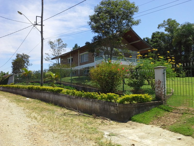 Chácara à venda Chácaras Reunidas Canadá com 400m² e 4 quartos por R$ 1.800.000 - 1235480960-lateral-de-fora-casa.jpg