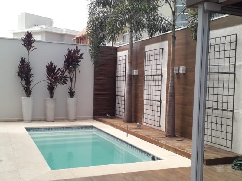 Casa de condomínio à venda Centro com 220m² e 5 quartos por R$ 1.300.000 - 2002042369-area-lazer-piscina-aquecida-solarium.jpeg