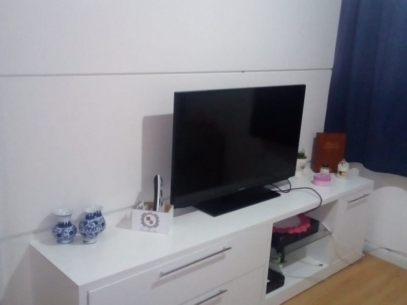 Apartamento à venda Bandeiras com 57m² e 2 quartos por R$ 230.000 - 139257371-foto-painel-da-sala1.jpeg