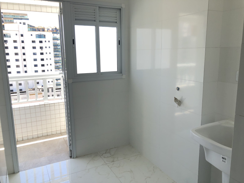 Apartamento à venda Guilhermina com 158m² e 3 quartos por R$ 860.000 - vista-da-lavanderia-e-saida-para-a-sacada-funcional.jpg