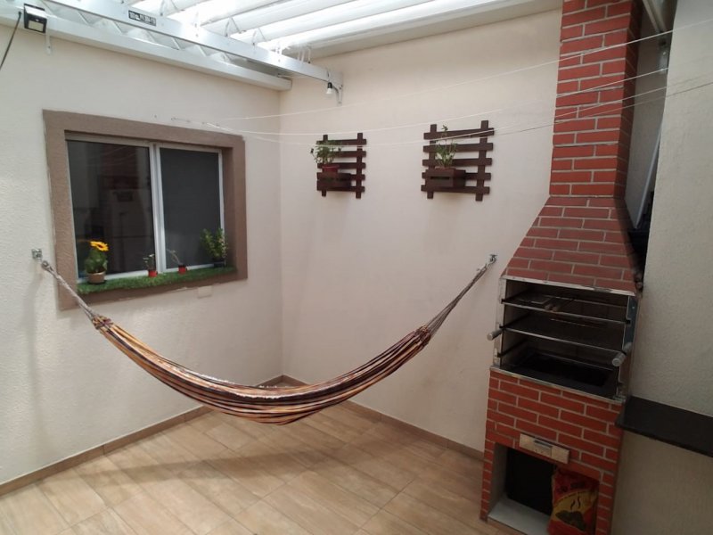 Casa de condomínio à venda Jardim Celia com 70m² e 2 quartos por R$ 350.000 - 837327677-quintal-janela-e-churrasqueira.jpeg