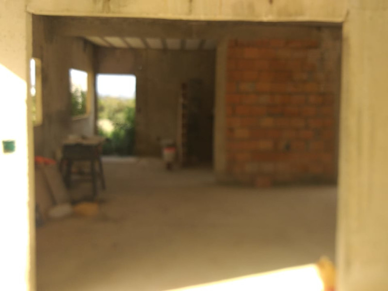 Casa de condomínio à venda Centro com 400m² e 4 quartos por R$ 600.000 - obra-foto-lateral-gar-sala.jpeg