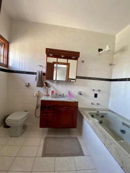 Casa à venda Vila Santa Rosa com 166m² e 3 quartos por R$ 580.000 - 228847444-suite.jpg