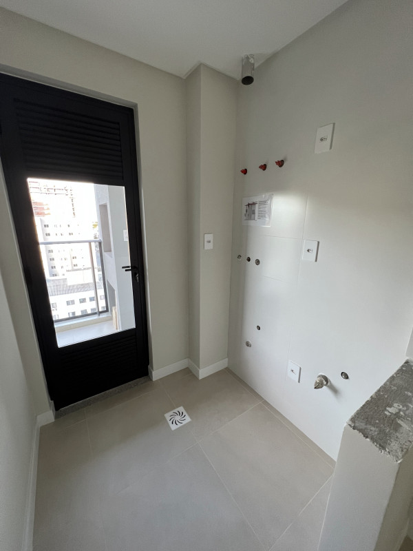 Apartamento à venda Praia Brava com 64m² e 2 quartos por R$ 740.000 - 411184402-areadeservico.jpg