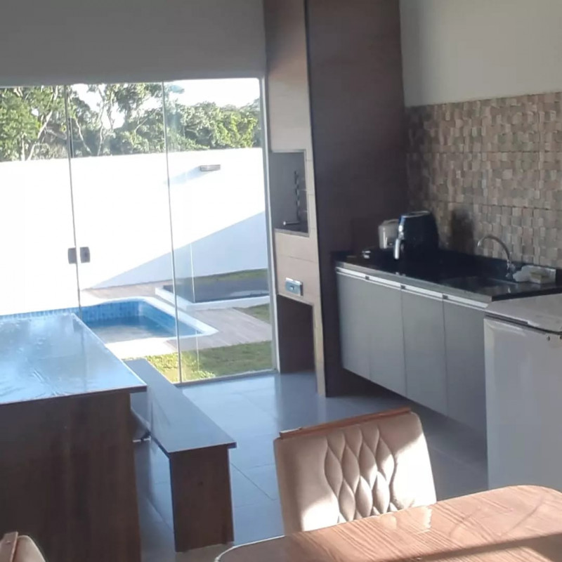 Casa de condomínio à venda Ninho Verde com 170m² e 3 quartos por R$ 650.000 - 607869771-area-gourmet.jpeg