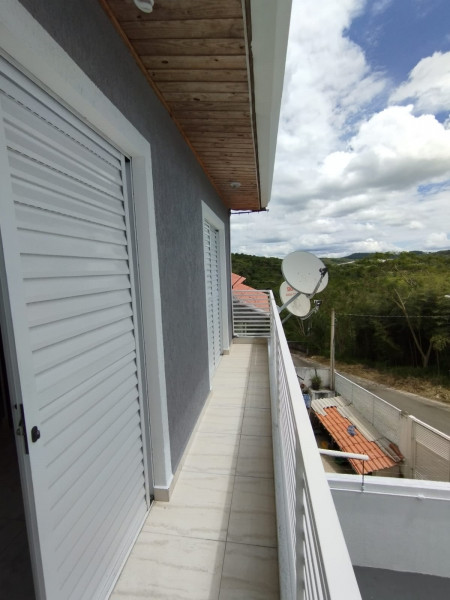 Casa à venda Aguassai com 70m² e 3 quartos por R$ 375.000 - 1765179000-foto-sacada-frente-quarto-03-e-02.jpeg