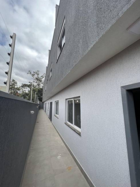 Casa de condomínio à venda Cibratel II com 165m² e 3 quartos por R$ 610.000 - 1336497816-lateral.jpg