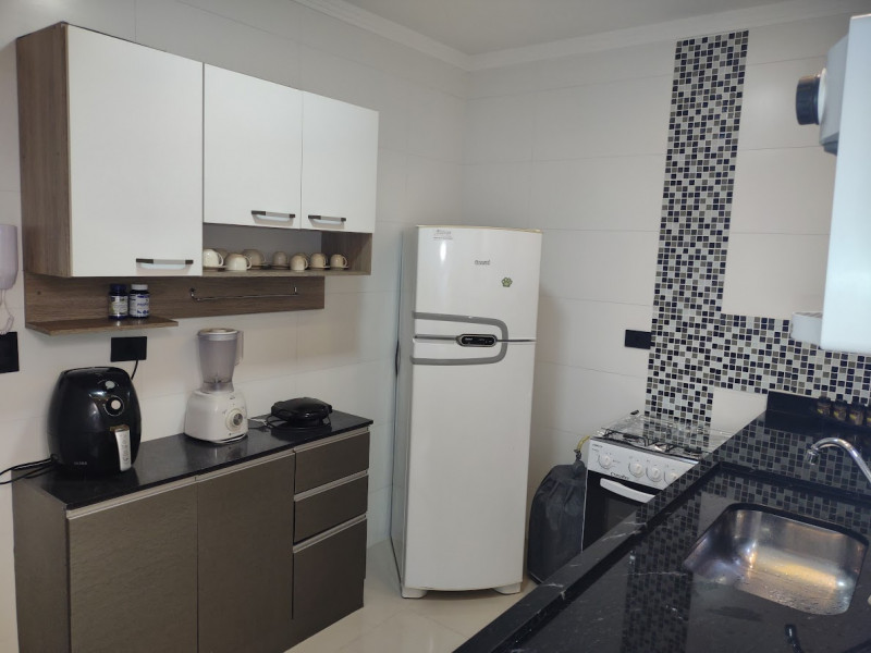 Casa de condomínio à venda Cidade Ocian com 55m² e 2 quartos por R$ 290.000 - 1084292106-cozinha-3.jpg
