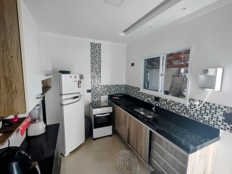 Casa de condomínio à venda Cidade Ocian com 55m² e 2 quartos por R$ 290.000 - 2123106177-cozinha-4.jpg
