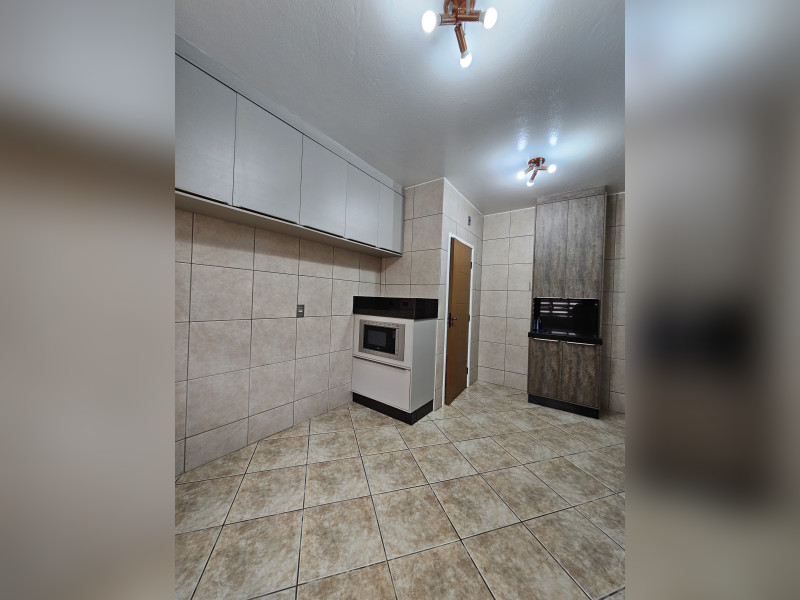 Casa à venda Forquilhas com 114m² e 3 quartos por R$ 620.000 - 17-conzinha-planejada-visao-porta.jpg
