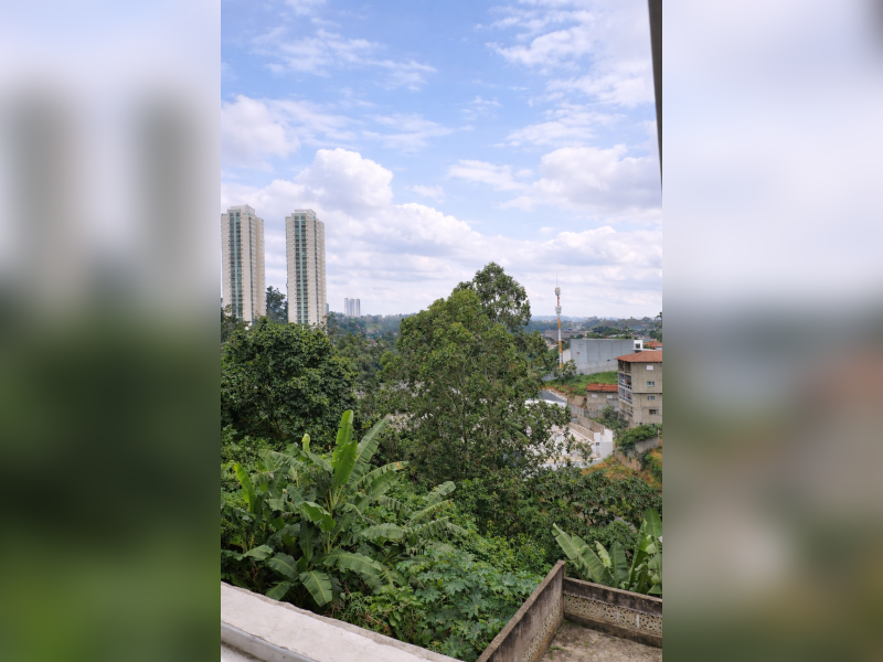 Casa à venda Jardim Sílvia com 173m² e 3 quartos por R$ 397.000 - sobrado-aconchegante-em-embu-das-artes-vista-panoramica-vale-verde-predios-ao-fundo-ceu-parcialmente-nublado.png